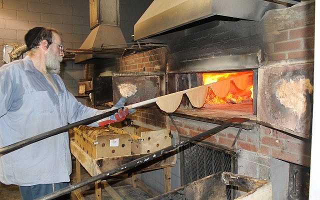 It takes about 20 seconds in a 1,300-degree Fahrenheit, coal-and-wood-fired oven to bake shmurah matzah to perfection. (Uriel Heilman) It takes about 20 seconds in a 1,300-degree Fahrenheit, coal-and-wood-fired oven to bake shmurah matzah to perfection. (Uriel Heilman/JTA)