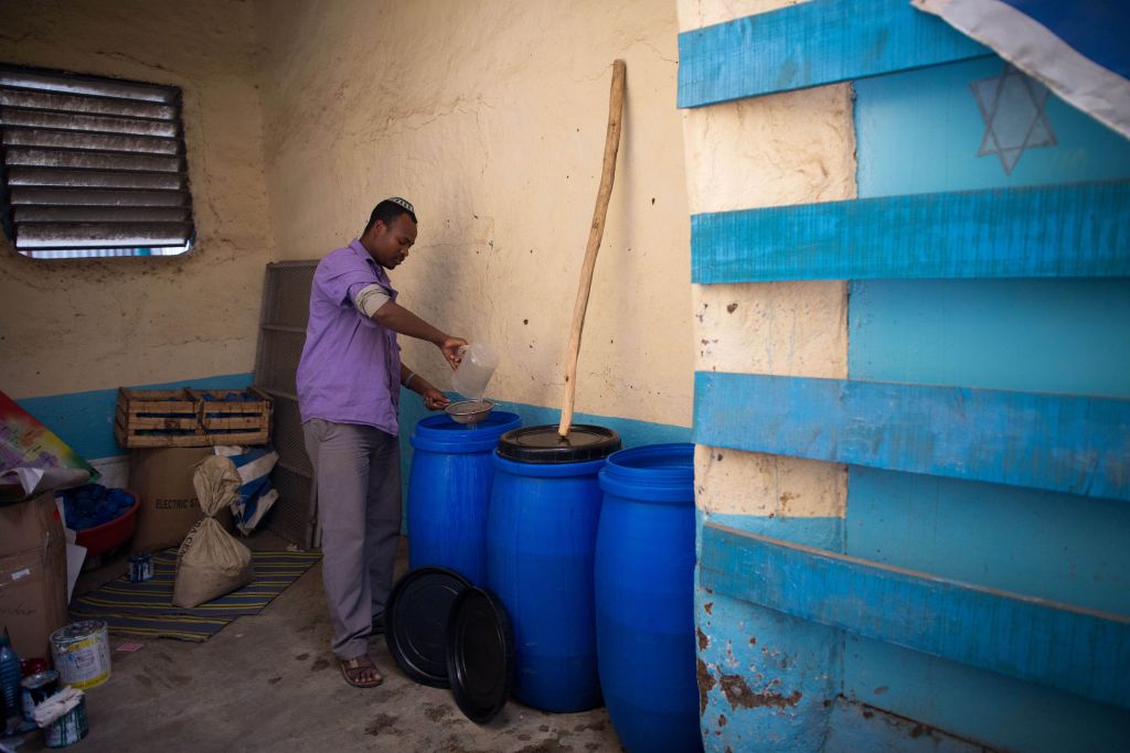 The Jewish community of Gondar, Ethiopia, makes its own wine for the seder out of fermented raisins. (Miriam Alster/Flash90) The Jewish community of Gondar, Ethiopia, makes its own wine for the seder out of fermented raisins. (Miriam Alster/Flash90)