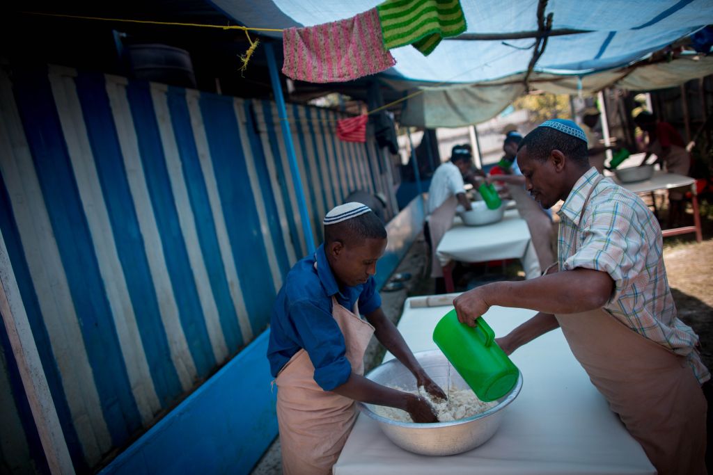 Members of Gondar's Jewish community prepare matzah before Passover on April 20, 2016. It takes more than 40 people a week to prepare the unleavened bread for the community. (Miriam Alster/Flash90) Members of Gondar's Jewish community prepare matzah before Passover on April 20, 2016. It takes more than 40 people a week to prepare the unleavened bread for the community. (Miriam Alster/Flash90)