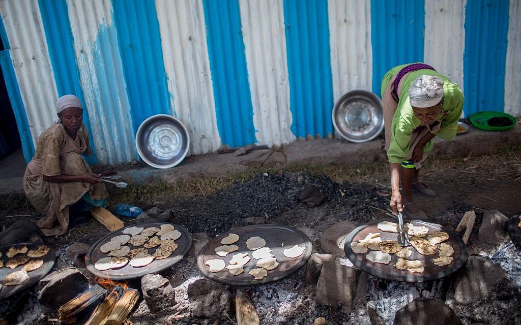 Members of the Gondar, Ethiopia, Jewish community prepare matzah before Passover on April 20, 2016. (Miriam Alster/Flash90)