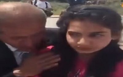 Dima al-Wawi being united with her father on April 24, 2016 (screen capture: YouTube/alAqsa TV)
