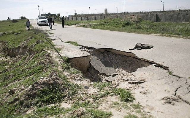 A picture taken on March 1, 2016 shows a deep crack on an asphalt road next to the border between Egypt and Gaza, in the city of Rafah, in the southern Gaza Strip. (AFP PHOTO / SAID KHATIB) A picture taken on March 1, 2016 shows a deep crack on an asphalt road next to the border between Egypt and Gaza, in the city of Rafah, in the southern Gaza Strip. (AFP PHOTO / SAID KHATIB)