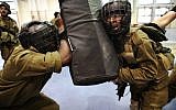 Soldiers from the IDF's Golani Brigade seen during Krav Maga training at the Regavim Army base on April 19, 2016. (AFP PHOTO / MENAHEM KAHANA)