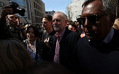 Britain's opposition Labour Party leader Jeremy Corbyn, center, leaves after giving a speech at a May Day rally in London on May 1, 2016. (AFP/JUSTIN TALLIS)