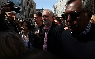 Britain's opposition Labour Party leader Jeremy Corbyn, center, leaves after giving a speech at a May Day rally in London on May 1, 2016. (AFP/JUSTIN TALLIS)
