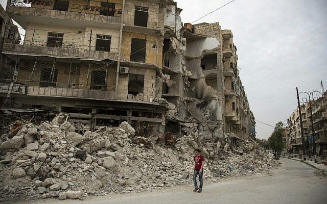 A Syrian man walks past destroyed buildings on May 2, 2016, in Aleppo's Bab al-Hadid neighborhood which was targeted recently by regime air strikes. (AFP/KARAM AL-MASRI) A Syrian man walks past destroyed buildings on May 2, 2016, in Aleppo's Bab al-Hadid neighborhood which was targeted recently by regime air strikes. (AFP/KARAM AL-MASRI)