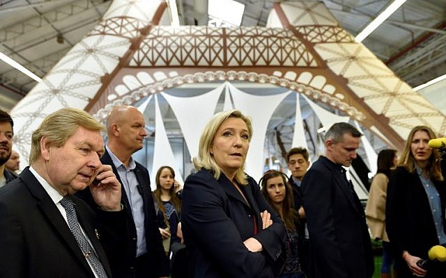 National Front party head Marine Le Pen, center, visits a stand of the "Concours Lepine" at a Paris fair, May 4, 2016. (AFP/Eric Feferberg) National Front party head Marine Le Pen, center, visits a stand of the "Concours Lepine" at a Paris fair, May 4, 2016. (AFP/Eric Feferberg)