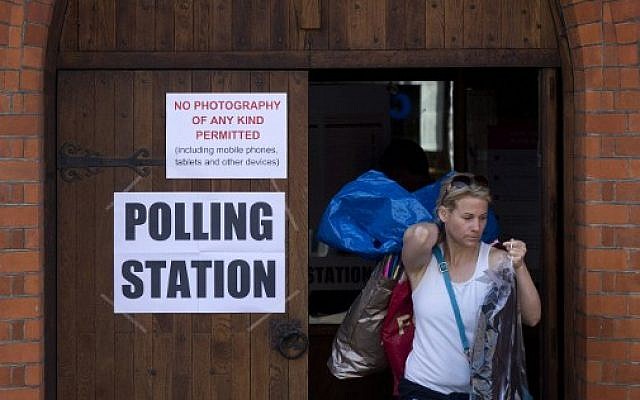 A voter leaves a polling station in a church in south London on May 5, 2016, after casting a ballot for the city's next mayor. (AFP PHOTO/JUSTIN TALLIS) A voter leaves a polling station in a church in south London on May 5, 2016, after casting a ballot for the city's next mayor. (AFP PHOTO/JUSTIN TALLIS)