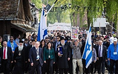 Participants of the annual "March of the Living" are seen as they pass the main gate of the former Nazi death camp in Oswiecim (Auschwitz), Poland, on May 5, 2016. (AFP PHOTO / WOJTEK RADWANSKI)