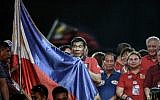 Presidential candidate and Davao Mayor Rodrigo Duterte holds his national flag as he addresses his supporters during an election campaign rally ahead of the presidential and vice presidential elections in Manila, the Philippines, on May 7, 2016. (Mohd Rasfan/AFP)