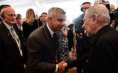 Britain's new London Mayor Sadiq Khan (C) shakes hands with Holocaust survivor Harry Fleming as he attends the Yom HaShoah Commemoration, the UK Jewish community's Holocaust remembrance ceremony, in Barnet, north London, on May 8, 2016.(AFP PHOTO / LEON NEAL)