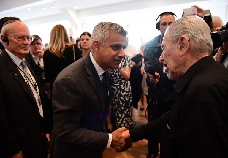 Britain's new London Mayor Sadiq Khan (C) shakes hands with Holocaust survivor Harry Fleming as he attends the Yom HaShoah Commemoration, the UK Jewish community's Holocaust remembrance ceremony, in Barnet, north London, on May 8, 2016.(AFP PHOTO / LEON NEAL) Britain's new London Mayor Sadiq Khan (C) shakes hands with Holocaust survivor Harry Fleming as he attends the Yom HaShoah Commemoration, the UK Jewish community's Holocaust remembrance ceremony, in Barnet, north London, on May 8, 2016.(AFP PHOTO / LEON NEAL)
