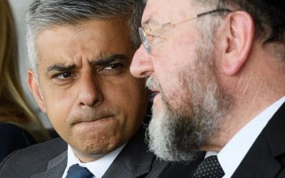 Mayor of London Sadiq Khan talks with Chief Rabbi Ephraim Mirvis of the United Congregations of the Commonwealth ahead of the Yom HaShoah Commemoration, the UK Jewish community's Holocaust remembrance ceremony, in Barnet, north London, on May 8, 2016. (AFP PHOTO / LEON NEAL)