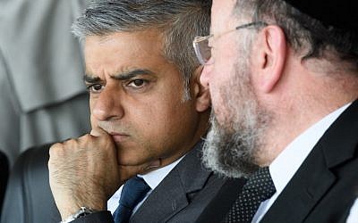 The Mayor of London Sadiq Khan talks with Chief Rabbi Ephraim Mirvis of the United Congregations of the Commonwealth ahead of the Yom HaShoah Commemoration, the UK Jewish community's Holocaust remembrance ceremony, in Barnet, north London, on May 8, 2016. (AFP PHOTO / LEON NEAL) The Mayor of London Sadiq Khan talks with Chief Rabbi Ephraim Mirvis of the United Congregations of the Commonwealth ahead of the Yom HaShoah Commemoration, the UK Jewish community's Holocaust remembrance ceremony, in Barnet, north London, on May 8, 2016. (AFP PHOTO / LEON NEAL)