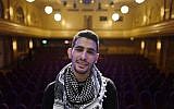 Palestinian/Syrian refugee Ayham Ahmad, also known as "the pianist of Yarmouk" poses prior to a performance at Berlin's Heimathafen concert hall on May 12, 2016. / AFP PHOTO / John MACDOUGALL