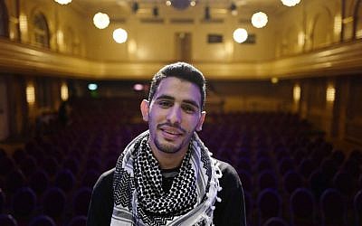 Palestinian/Syrian refugee Ayham Ahmad, also known as "the pianist of Yarmouk" poses prior to a performance at Berlin's Heimathafen concert hall on May 12, 2016. / AFP PHOTO / John MACDOUGALL Palestinian/Syrian refugee Ayham Ahmad, also known as "the pianist of Yarmouk" poses prior to a performance at Berlin's Heimathafen concert hall on May 12, 2016. / AFP PHOTO / John MACDOUGALL