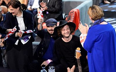 Niko Kocharov and Young Georgian Lolitaz representing Georgia celebrate as they advance to the grand final, after qualifying in the second semi-final of the Eurovision Song Contest 2016 in Stockholm, Sweden, on May 12, 2016. (AFP PHOTO / JONATHAN NACKSTRAND)