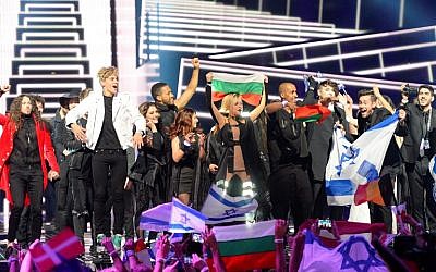 Singers and delegations celebrate as they advance to the Grand Final of the Eurovision Song Contest 2016 in Stockholm, Sweden, on May 12, 2016. (AFP/Jonathan Nackstrand)