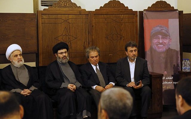 (From L-R) Lebanese Hezbollah deputy chief Sheikh Naim Qassem, head of the Hezbollah Executive Council Sayyed Hashem Safieddine, and the brothers, Annan Badreddine and Hassan Badreddine, of top Hezbollah commander Mustafa Badreddine who was killed in an attack in Syria, receive condolences in a southern suburb of Beirut, on May 13, 2016. (AFP PHOTO / ANWAR AMRO) (From L-R) Lebanese Hezbollah deputy chief Sheikh Naim Qassem, head of the Hezbollah Executive Council Sayyed Hashem Safieddine, and the brothers, Annan Badreddine and Hassan Badreddine, of top Hezbollah commander Mustafa Badreddine who was killed in an attack in Syria, receive condolences in a southern suburb of Beirut, on May 13, 2016. (AFP PHOTO / ANWAR AMRO)
