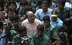 Bangladeshi security personnel escort Bangladesh Nationalist Party (BNP) joint secretary general Aslam Chowdhury, center, to court following his arrest in Dhaka on May 16, 2016. (STR/AFP)
