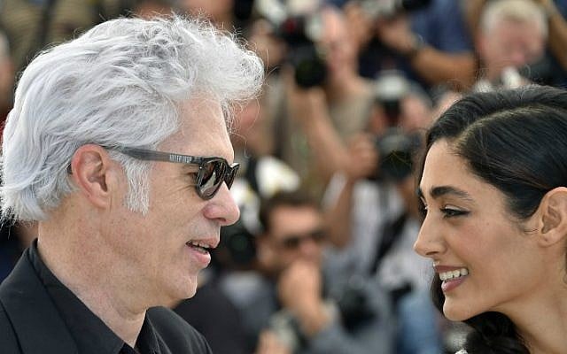 US director Jim Jarmusch, left, and French-Iranian actress Golshifteh Farahani pose on May 16, 2016 during a photocall for the film "Paterson" at the 69th Cannes Film Festival in Cannes, southern France. (Loic Venance/AFP)