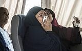 A relative of a passenger who was flying aboard an EgyptAir plane that vanished from radar en route from Paris to Cairo overnight cries as family members are transported by bus to a gathering point at Cairo airport on May 19, 2016. (AFP PHOTO / KHALED DESOUKI)