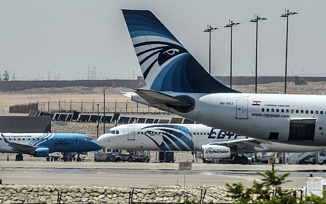EgyptAir planes are seen on the tarmac at Cairo international airport on May 19, 2016 after an EgyptAir flight from Paris to Cairo crashed into the Mediterranean on with 66 people on board, prompting an investigation into whether it was mechanical failure or a bomb. (AFP PHOTO / KHALED DESOUKI)
