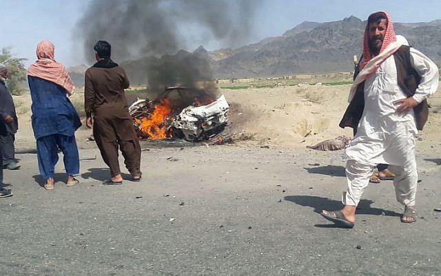 Pakistani local residents gathering around a destroyed vehicle hit by a drone strike in which Afghan Taliban Chief Mullah Akhtar Mansour was believed to be travelling in the remote town of Ahmad Wal in Balochistan, May 21, 2016. (AFP) Pakistani local residents gathering around a destroyed vehicle hit by a drone strike in which Afghan Taliban Chief Mullah Akhtar Mansour was believed to be travelling in the remote town of Ahmad Wal in Balochistan, May 21, 2016. (AFP)
