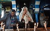 French Tunisian Jewish women pray at the Ghriba synagogue in the Tunisian resort island of Djerba during the annual Jewish Lag B'Omer pilgrimage, May 25, 2016. (AFP Photo/Fethi Belaid)