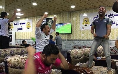 Young supporters of the Real Madrid football club  celebrate their team's victory in the Champions League final on May 28, 2016 in the Iraqi town of Balad, two weeks after their fan club was hit by a deadly shooting attack officials say left 16 people dead. (AFP)

 
The deadly attack was claimed by the Islamic State group and sparked an outpouring of sympathy from the football world. / AFP PHOTO / Jean-Marc Mojon