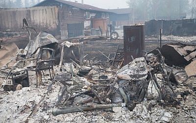 Home foundations and skeletons of possesions are all that remain in parts of a residential neighborhood destroyed by a wildfire on May 7, 2016 in Fort McMurray, Canada.(Scott Olson/Getty Images/AFP)