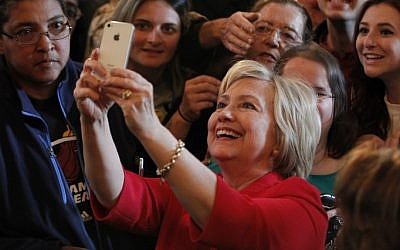 Democratic presidential candidate Hillary Clinton takes a selfie with campaign supporters after her address at a campaign rally at La Gala May 16, 2016, in Bowling Green, Kentucky. ( John Sommers II/Getty Images/AFP)