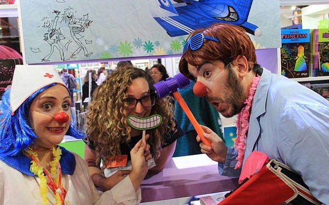 Visitors to the 42nd annual Buenos Aires International Book Fair have fun at the Israeli booth in Buenos Aires, Argentina, in April 2016. (Courtesy Israeli Embassy in Argentina via the Buenos Aires International Book Fair) Visitors to the 42nd annual Buenos Aires International Book Fair have fun at the Israeli booth in Buenos Aires, Argentina, in April 2016. (Courtesy Israeli Embassy in Argentina via the Buenos Aires International Book Fair)