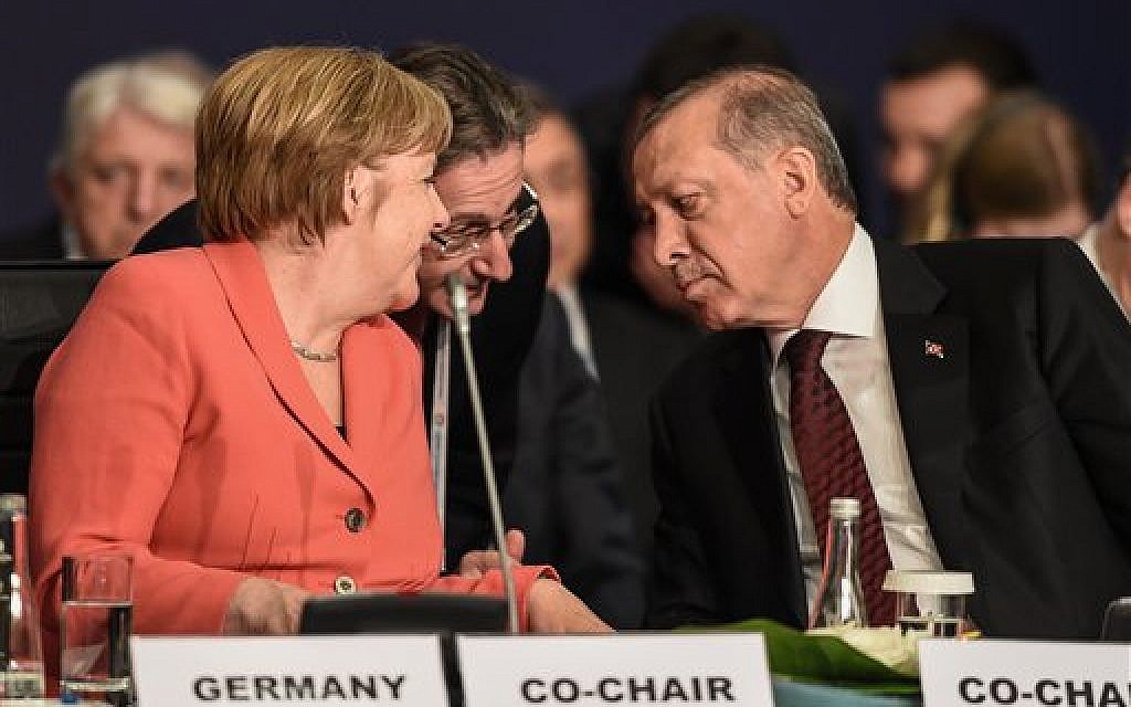 German Chancellor Angela Merkel, left, talks through an interpreter to Turkey's President Recep Tayyip Erdogan, right, during the World Humanitarian Summit in Istanbul on May 23, 2016. (Ozan Kose/Pool Photo via AP)