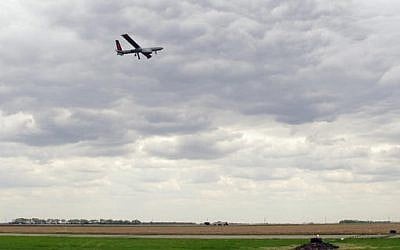 An Israeli-built Hermes 450 drone takes off from the Hillsboro, ND, airport on Friday, May 20, 2016, in its first flight to collect agriculture data in the Red River Valley. (AP Photo/Dave Kolpack)