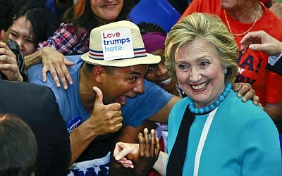 Democratic presidential candidate Hillary Clinton greets supporters as she campaigns at East Los Angeles College in Los Angeles, California, Thursday, May 5, 2016. (AP Photo/Damian Dovarganes)