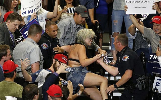 A protester is removed during a speech by Republican presidential candidate Donald Trump at a campaign event in Albuquerque, New Mexico, May 24, 2016. (AP Photo/Brennan Linsley) A protester is removed during a speech by Republican presidential candidate Donald Trump at a campaign event in Albuquerque, New Mexico, May 24, 2016. (AP Photo/Brennan Linsley)
