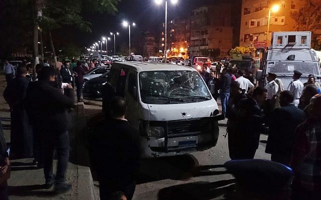 Egyptian police and civilians gather around a bullet ridden minibus in the south Cairo neighborhood of Helwan, Sunday, May 8, 2016. (AP/Mohsen Nabil) Egyptian police and civilians gather around a bullet ridden minibus in the south Cairo neighborhood of Helwan, Sunday, May 8, 2016. (AP/Mohsen Nabil)