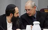 Sholom Rabashkin, left, speaks with his defense attorney Montgomery Brown at Rubashkin's trial on state child labor charges on May 14, 2010, at the Black Hawk County Courthouse in Waterloo, Iowa. (Andrea Melendez/AP)
