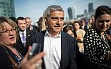 Newly elected London Mayor Sadiq Khan is greeted by well wishers outside City Hall in London, on his first day as mayor, Monday May 9, 2016. (Jonathan Brady/PA via AP)