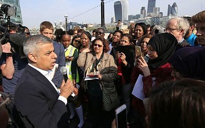 Newly elected London mayor Sadiq Khan speaks to the media and well wishers outside City Hall in London, on his first day as mayor, Monday May 9, 2016. (Jonathan Brady/PA via AP)