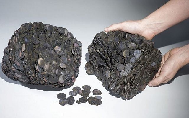 Lumps of coins discovered in the sea at the site of the ancient sea port of Caesarea, Israel, April 2016. (Clara Amit, courtesy of the Israel Antiquities Authority)