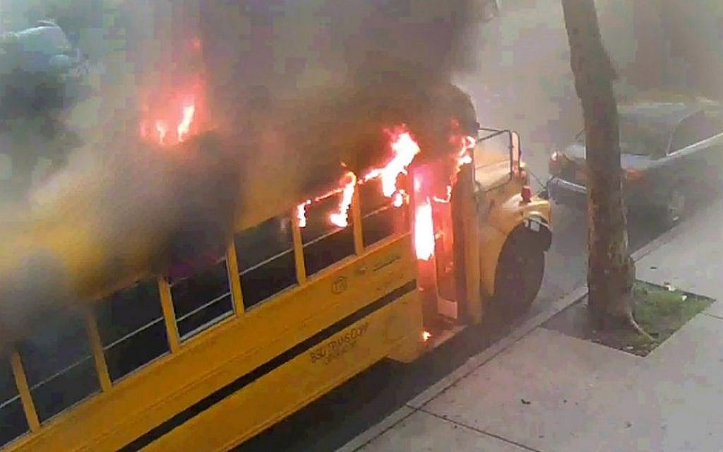 In this frame grab taken from surveillance video, a school bus burns after it was set on fire by children Sunday, May 8, 2016, in the Crown Heights section of the Brooklyn borough of New York. (Beth Rifkah School via AP) In this frame grab taken from surveillance video, a school bus burns after it was set on fire by children Sunday, May 8, 2016, in the Crown Heights section of the Brooklyn borough of New York. (Beth Rifkah School via AP)