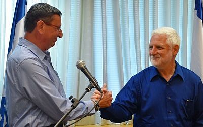Maj. Gen. (res.) Udi Adam, left, takes over as director-general of the Defense Ministry for the outgoing Dan Harel, right, during an official ceremony in the army's Tel Aviv headquarters on May 26, 2016. (Defense Ministry) Maj. Gen. (res.) Udi Adam, left, takes over as director-general of the Defense Ministry for the outgoing Dan Harel, right, during an official ceremony in the army's Tel Aviv headquarters on May 26, 2016. (Defense Ministry)