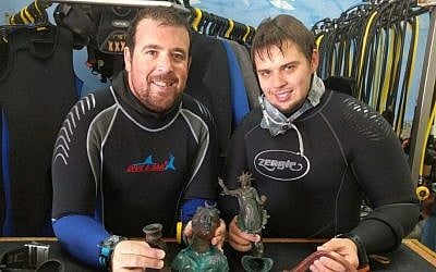 The divers, Ran Feinstein, right, and Ofer Ra‘anan after the discovery. (The Old Caesarea Diving Center)