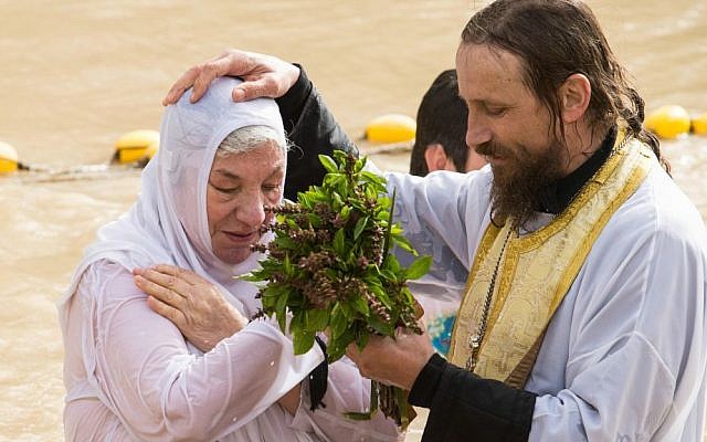 A baptism at the Qasr al-Yahud holy site on the Jordan River, where many Christian denominations believe Jesus was baptized. (HALO Trust)
