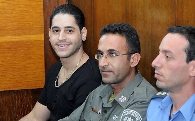 Avi Abutbul,left, sits in the Tel Aviv District Court, September 22, 2009. (Yossi Zeliger/FLASH90) Avi Abutbul,left, sits in the Tel Aviv District Court, September 22, 2009. (Yossi Zeliger/FLASH90)
