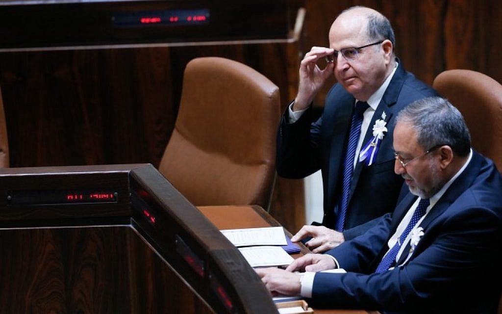 Former defense minister Moshe Ya'alon sits with Yisrael Beytenu party leader Avigdor Liberman during a swearing in ceremony for the 20th Knesset in Jerusalem on March 31, 2015. (Miriam Alster/Flash90) Former defense minister Moshe Ya'alon sits with Yisrael Beytenu party leader Avigdor Liberman during a swearing in ceremony for the 20th Knesset in Jerusalem on March 31, 2015. (Miriam Alster/Flash90)
