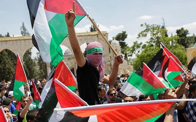 Palestinians wave their national flag during a demonstration to mark the "Nakba" or "catastrophe," a reference to the birth of the state of Israel outside the Al-Aqsa mosque in Jerusalem's Old City on May 15, 2015. (Muath Al Khatib/Flash90) Palestinians wave their national flag during a demonstration to mark the "Nakba" or "catastrophe," a reference to the birth of the state of Israel outside the Al-Aqsa mosque in Jerusalem's Old City on May 15, 2015. (Muath Al Khatib/Flash90)