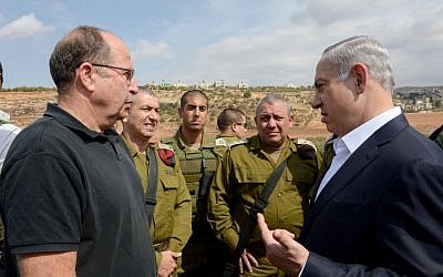 Prime Minister Benjamin Netanyahu, right, speaks with then-defense minister Moshe Ya'alon on October 6, 2015. (Amos Ben Gershom/GPO) Prime Minister Benjamin Netanyahu, right, speaks with then-defense minister Moshe Ya'alon on October 6, 2015. (Amos Ben Gershom/GPO)